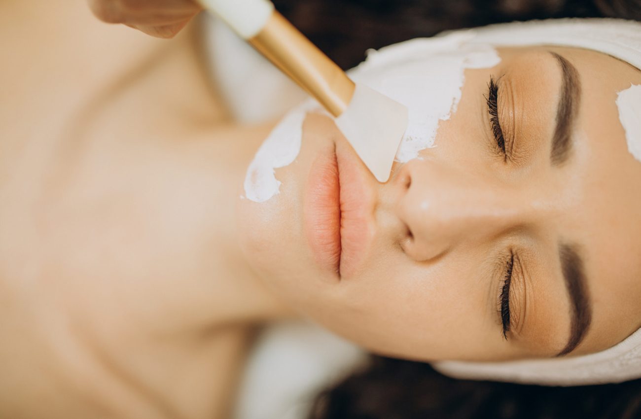 Woman visiting cosmetologist and making rejuvenation procedures